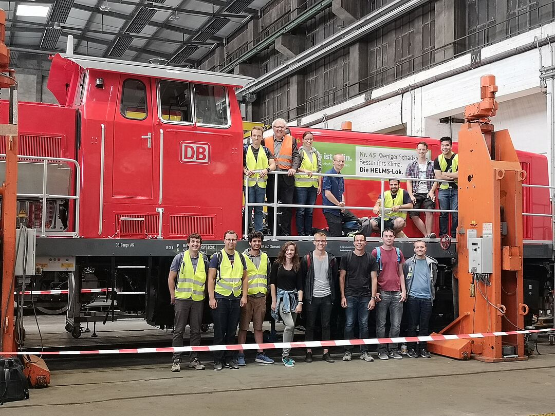 Students in front of a test locomotive 