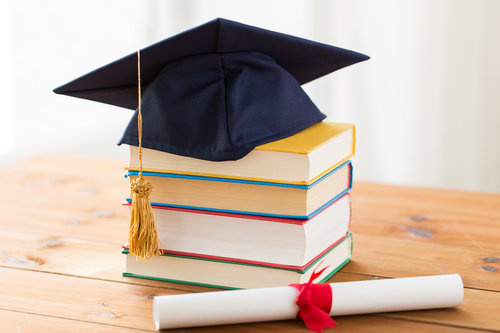 Doctoral cap on a stack of books