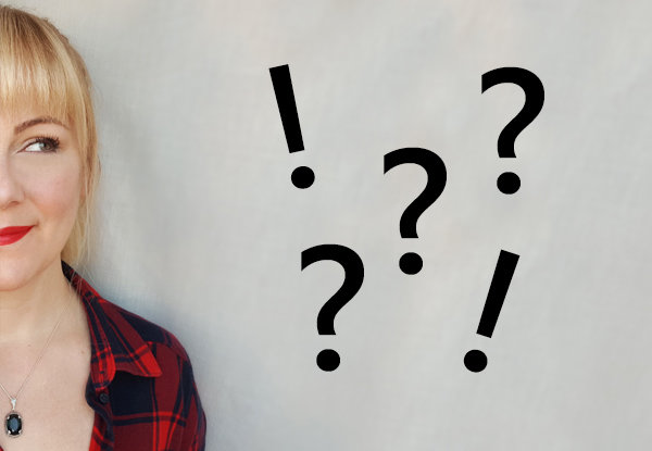 Decorative image: Head of a woman in front of a gray wall with question marks and exclamation marks