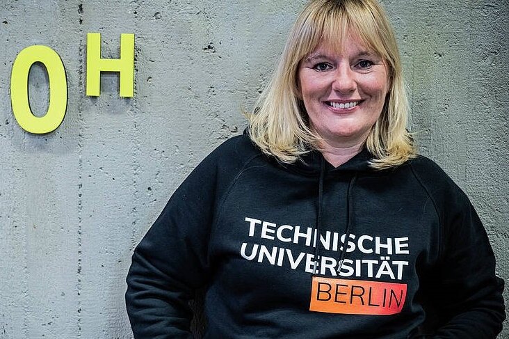 Woman wearing a TU Berlin hoodie