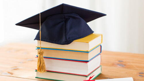 Doctoral cap on a stack of books