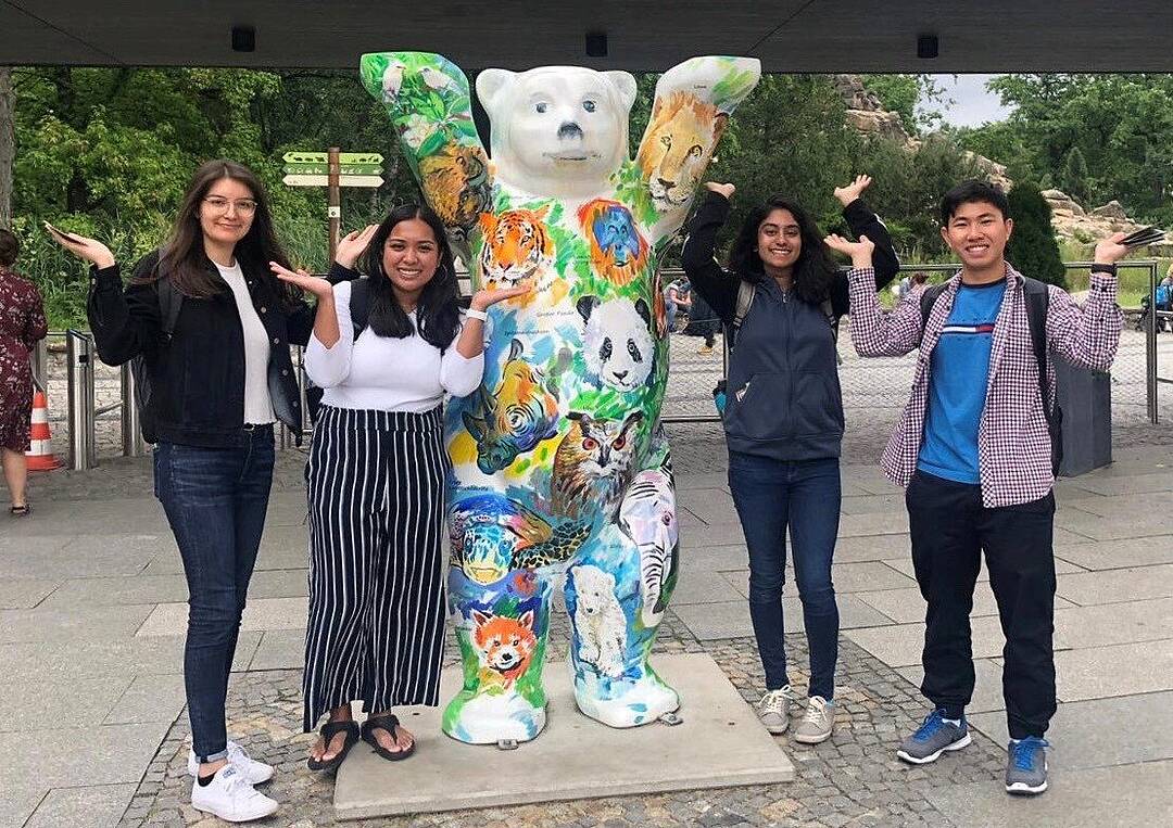 Summer University participants pose with a Berlin "Buddy Bear".